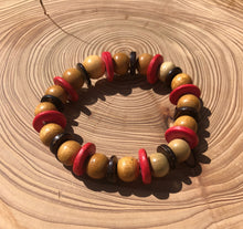 Load image into Gallery viewer, Handmade beaded bracelet on elastic. Made out pink, brown and beige recycled beads.