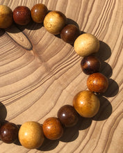 Load image into Gallery viewer, Handmade beaded bracelet on elastic. Made out of brown and beige recycled beads.