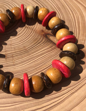 Load image into Gallery viewer, Handmade beaded bracelet on elastic. Made out pink, brown and beige recycled beads.