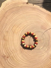 Load image into Gallery viewer, Handmade beaded bracelet on elastic. Made out pink, brown and beige recycled beads.