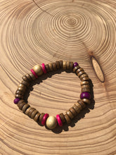 Load image into Gallery viewer, Handmade beaded bracelet on elastic. Made out hot pink, purple, brown and beige recycled beads.