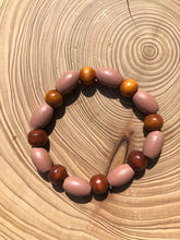 Load image into Gallery viewer, Handmade beaded bracelet on elastic. Made out dusty pink, brown and beige recycled beads.