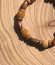 Load image into Gallery viewer, Handmade beaded bracelet on elastic. Made out of brown and beige textured recycled beads.