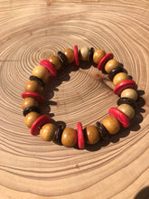 Load image into Gallery viewer, Handmade beaded bracelet on elastic. Made out pink, brown and beige recycled beads.