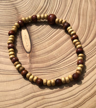 Load image into Gallery viewer, Handmade beaded bracelet on elastic. Made out of delicate small wooden recycled beads.