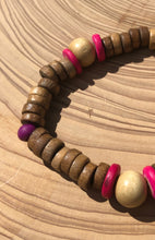 Load image into Gallery viewer, Handmade beaded bracelet on elastic. Made out hot pink, purple, brown and beige recycled beads.