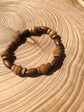 Load image into Gallery viewer, Handmade beaded bracelet on elastic. Made out of brown and beige textured recycled beads.