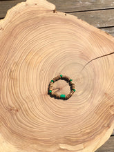 Load image into Gallery viewer, Handmade beaded bracelet on elastic. Made out of emerald green and brown recycled beads.