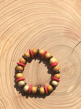 Load image into Gallery viewer, Handmade beaded bracelet on elastic. Made out pink, brown and beige recycled beads.