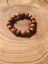 Load image into Gallery viewer, Handmade beaded bracelet on elastic. Made out pink, brown and beige recycled beads.