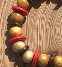 Load image into Gallery viewer, Handmade beaded bracelet on elastic. Made out pink, brown and beige recycled beads.