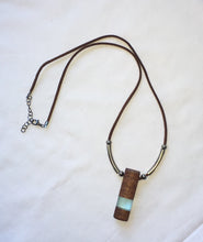 Load image into Gallery viewer, Pendant necklace handmade out of reclaimed hard wood and resin. On adjustable suede cord.