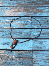 Load image into Gallery viewer, Pendant necklace handmade out of reclaimed hard wood and resin. On adjustable suede cord.