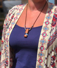 Load image into Gallery viewer, Pendant necklace handmade out of reclaimed hard wood and resin. On adjustable suede cord.