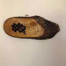 Load image into Gallery viewer, Bee and honey comb pyrography wood slice. Wood burning art on live edge ideal gift for nature lovers.