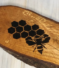 Load image into Gallery viewer, Bee and honey comb pyrography wood slice. Wood burning art on live edge ideal gift for nature lovers.