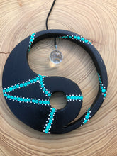Load image into Gallery viewer, Hand painted Yin yang suncatcher. Made from plywood, decorated with black, turquoise and white acrylic paint with crystal on faux suede cord.
