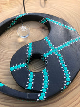 Load image into Gallery viewer, Hand painted Yin yang suncatcher. Made from plywood, decorated with black, turquoise and white acrylic paint with crystal on faux suede cord.
