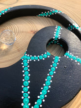 Load image into Gallery viewer, Hand painted Yin yang suncatcher. Made from plywood, decorated with black, turquoise and white acrylic paint with crystal on faux suede cord.

