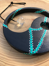 Load image into Gallery viewer, Hand painted Yin yang suncatcher. Made from plywood, decorated with black, turquoise and white acrylic paint with crystal on faux suede cord.
