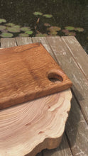 Load and play video in Gallery viewer, Solid oak hardwood chopping board with thumb hole as handle | food prep cutting board bbq serving platter or cheese board

