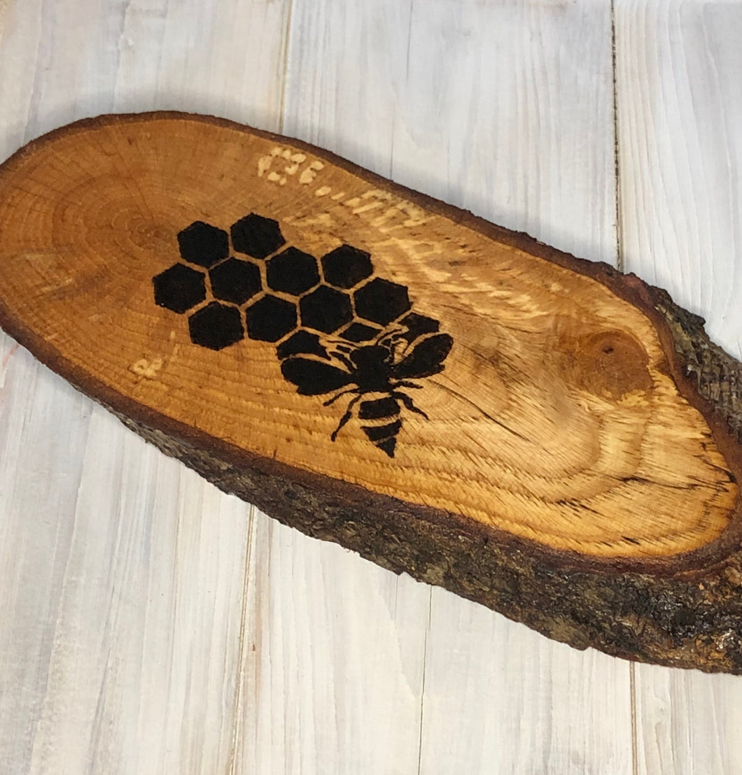 Bee and honey comb pyrography wood slice. Wood burning art on live edge ideal gift for nature lovers.